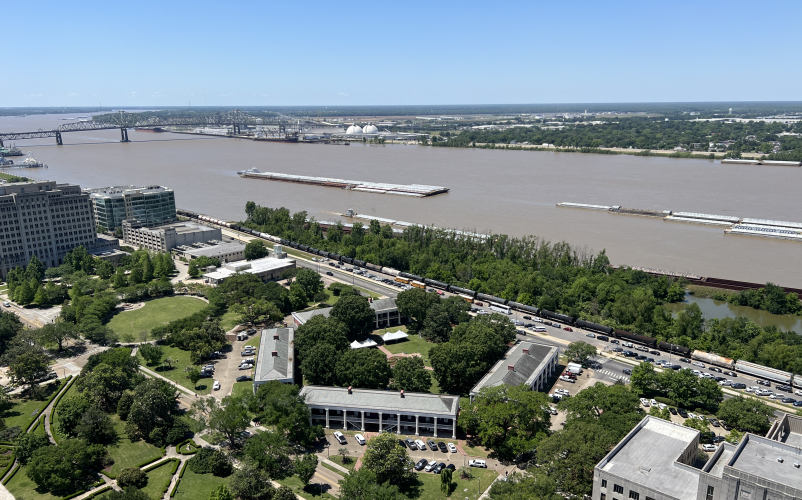 Baton-Rouge-river-pentagon-barracks-from-capitol View from the Observation Deck of the State Capitol showing the Mississippi River, the Pentagon Barracks, and the Rail line along the river.